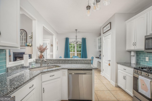 158 Sugarloaf Cir, Macon, GA 31204 - kitchen featuring stainless steel appliances, a sink, white cabinetry, and backsplash