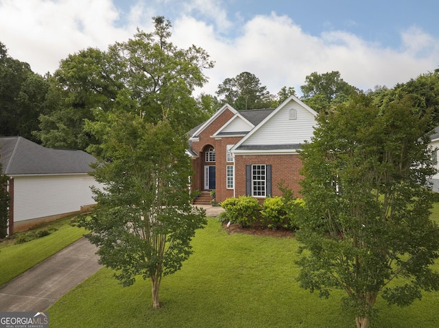 158 Sugarloaf Cir, Macon, GA 31204 - view of front of home featuring a front lawn, brick siding, and driveway
