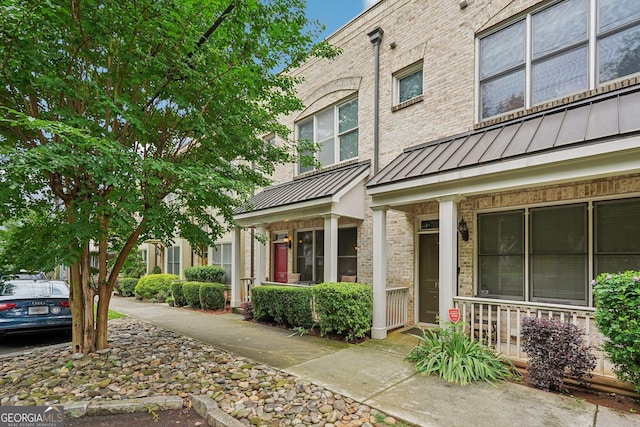 190 Marion Pl NE, Atlanta, GA 30307 - view of property featuring a standing seam roof, a porch, and metal roof