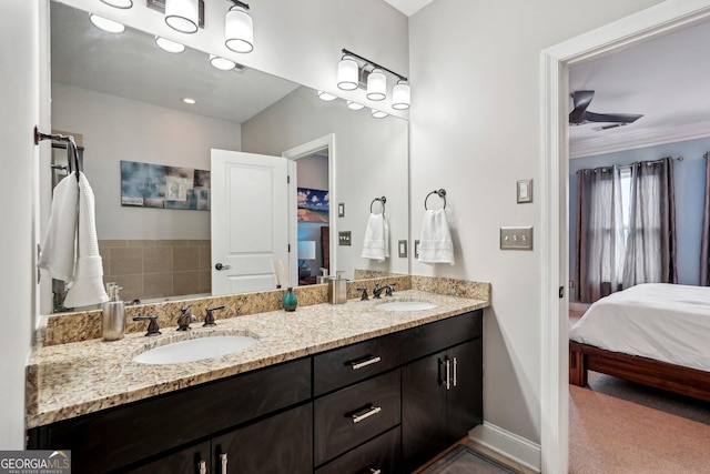 190 Marion Pl NE, Atlanta, GA 30307 - ensuite bathroom featuring double vanity, ornamental molding, and baseboards
