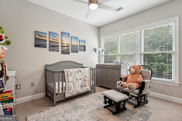 190 Marion Pl NE, Atlanta, GA 30307 - carpeted bedroom with multiple windows, a crib, and baseboards