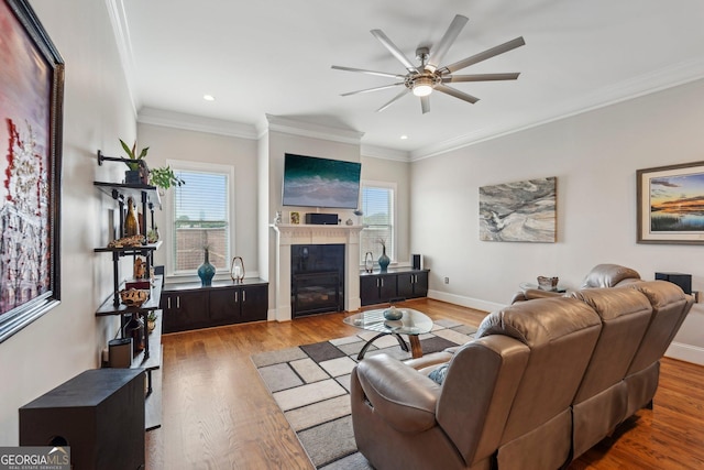 190 Marion Pl NE, Atlanta, GA 30307 - living area featuring healthy amount of natural light, a ceiling fan, a glass covered fireplace, recessed lighting, and wood finished floors