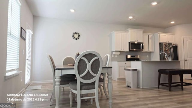 2757 Malton Way, Loganville, GA 30052 - dining space with light wood-style flooring and recessed lighting