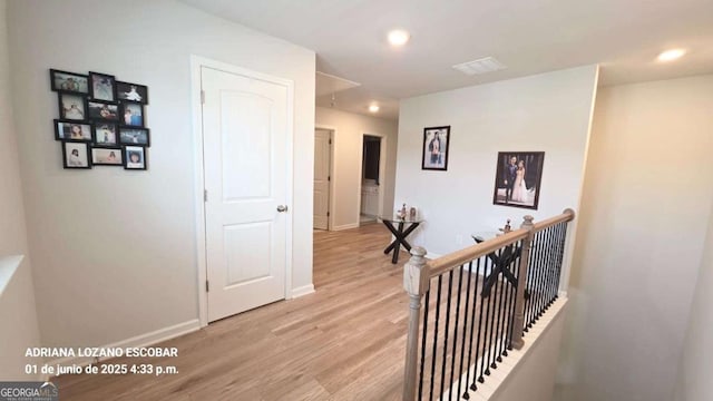 2757 Malton Way, Loganville, GA 30052 - hall with light wood-style floors, an upstairs landing, and recessed lighting