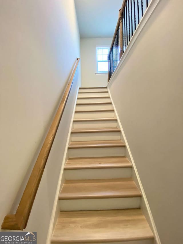 2757 Malton Way, Loganville, GA 30052 - stairs featuring wood finished floors