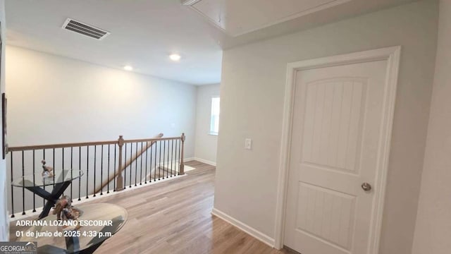 2757 Malton Way, Loganville, GA 30052 - hall featuring attic access, an upstairs landing, light wood-type flooring, and recessed lighting