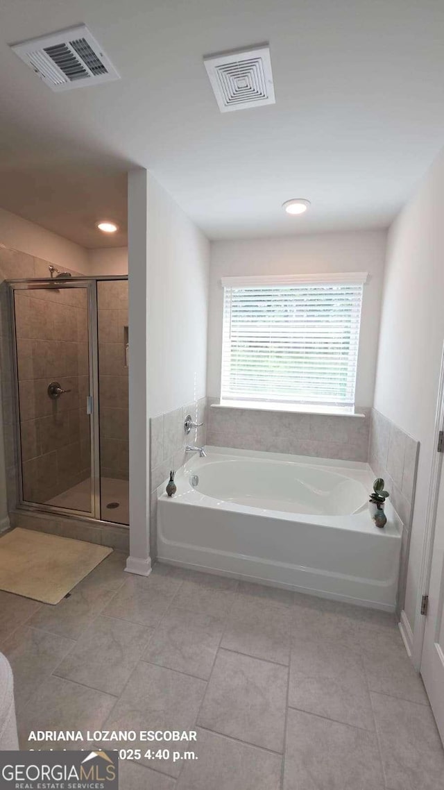 2757 Malton Way, Loganville, GA 30052 - full bathroom with a garden tub, tile patterned flooring, a stall shower, and recessed lighting