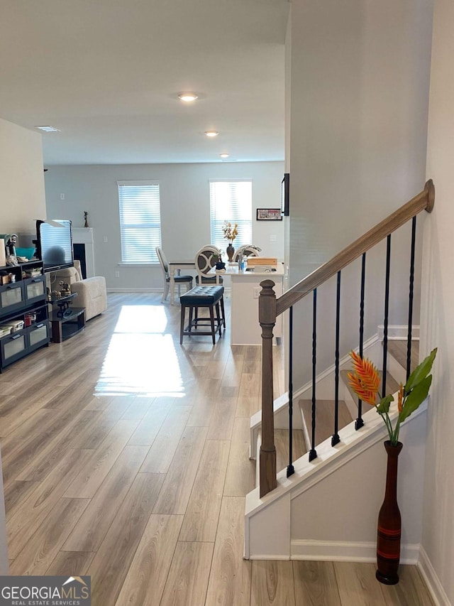2757 Malton Way, Loganville, GA 30052 - living area with light wood-style flooring, stairs, and recessed lighting