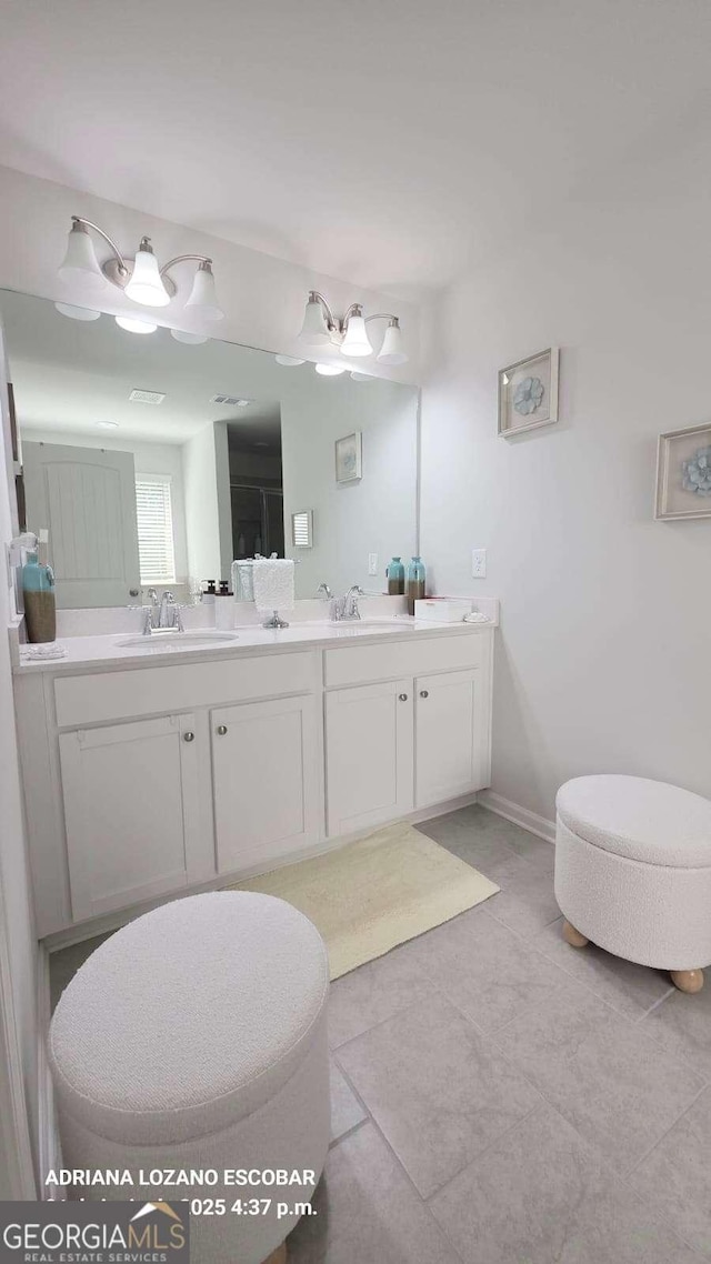 2757 Malton Way, Loganville, GA 30052 - bathroom featuring double vanity and tile patterned floors