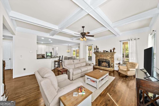 622 Rocky Creek Pt, Woodstock, GA 30188 - living area with dark wood-style flooring, beamed ceiling, coffered ceiling, ceiling fan, and a fireplace