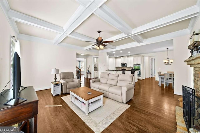 622 Rocky Creek Pt, Woodstock, GA 30188 - living room featuring ceiling fan, healthy amount of natural light, dark wood-style floors, coffered ceiling, and beam ceiling