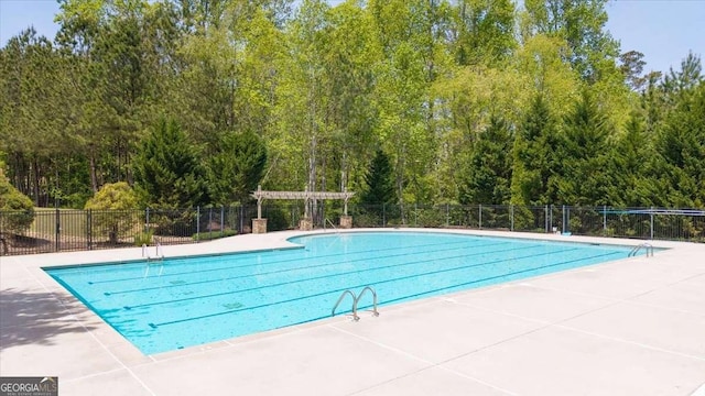 622 Rocky Creek Pt, Woodstock, GA 30188 - community pool featuring a patio and a forest view
