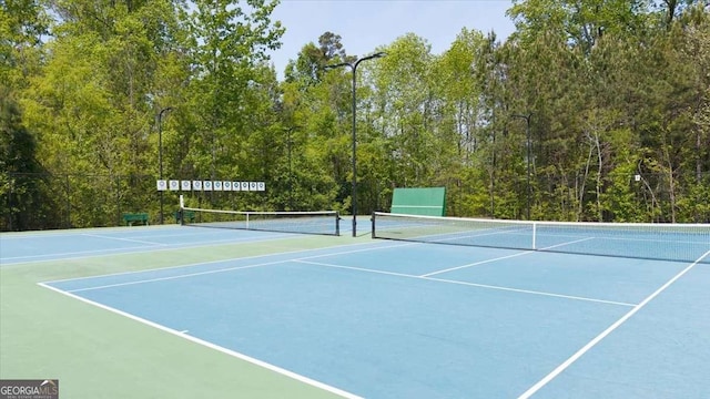 622 Rocky Creek Pt, Woodstock, GA 30188 - view of tennis court featuring community basketball court and a forest view