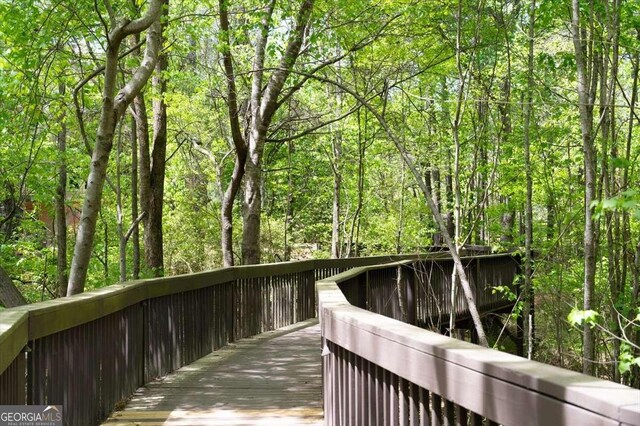 622 Rocky Creek Pt, Woodstock, GA 30188 - view of community featuring a forest view and a deck