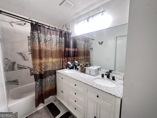 170 Graystone Cir, Macon, GA 31211 - full bath with a textured ceiling, double vanity, shower / bath combination with curtain, and marble look tile flooring