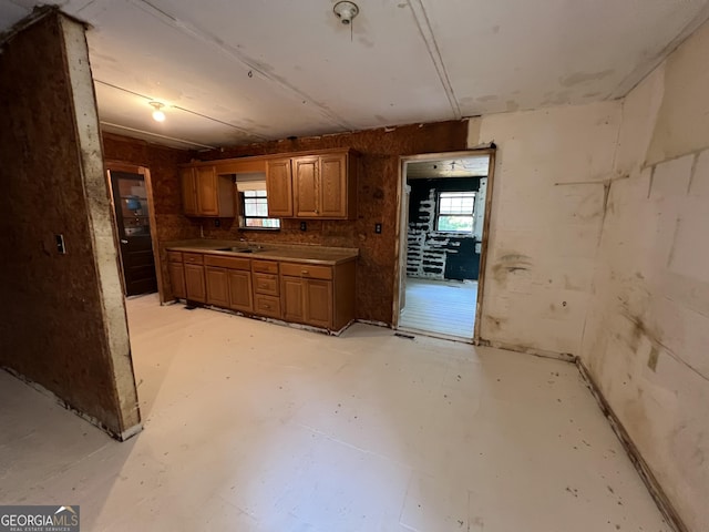60 Coltrane Rd, Dawsonville, GA 30534 - kitchen with a sink, concrete floors, and brown cabinets
