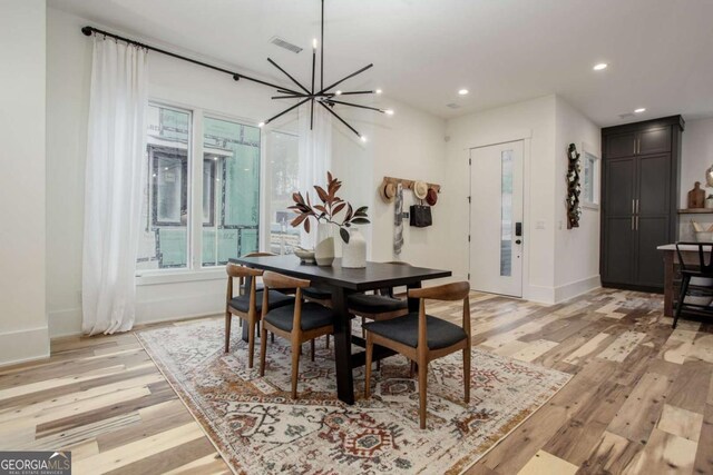 1168 Mado Loop, Chattahoochee Hills, GA 30268 - dining room featuring light wood finished floors, baseboards, a chandelier, and recessed lighting