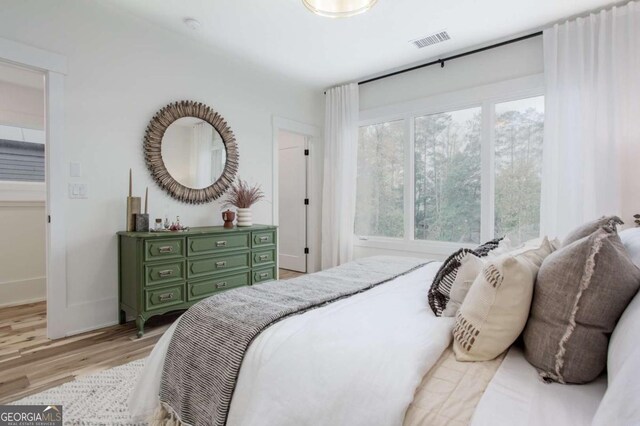 1168 Mado Loop, Chattahoochee Hills, GA 30268 - bedroom with light wood finished floors and baseboards