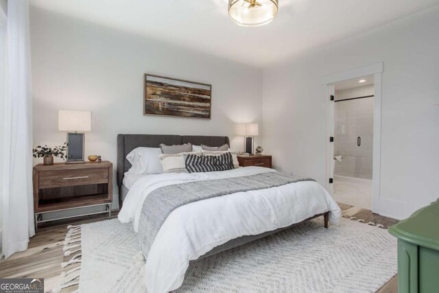 1168 Mado Loop, Chattahoochee Hills, GA 30268 - bedroom with light wood-type flooring and ensuite bath