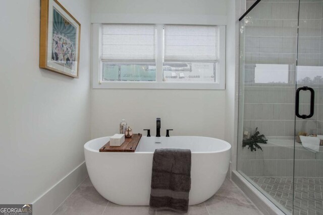 1168 Mado Loop, Chattahoochee Hills, GA 30268 - bathroom featuring healthy amount of natural light, a freestanding bath, and a stall shower