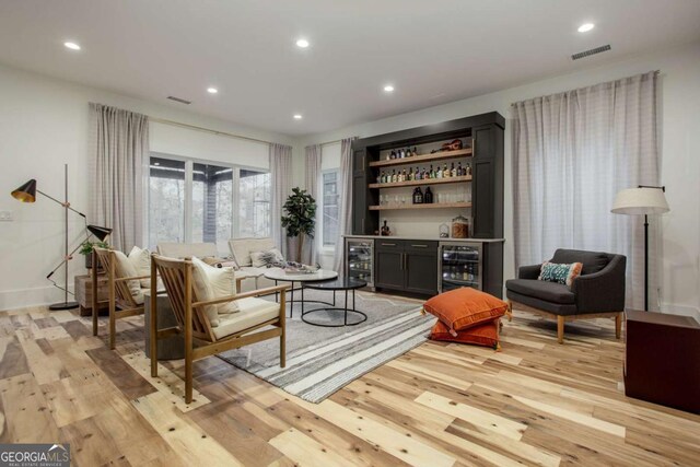 1168 Mado Loop, Chattahoochee Hills, GA 30268 - living room featuring beverage cooler, a dry bar, light wood finished floors, and recessed lighting