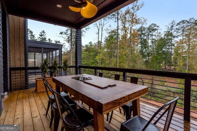 1168 Mado Loop, Chattahoochee Hills, GA 30268 - wooden deck featuring ceiling fan, a sunroom, and outdoor dining space