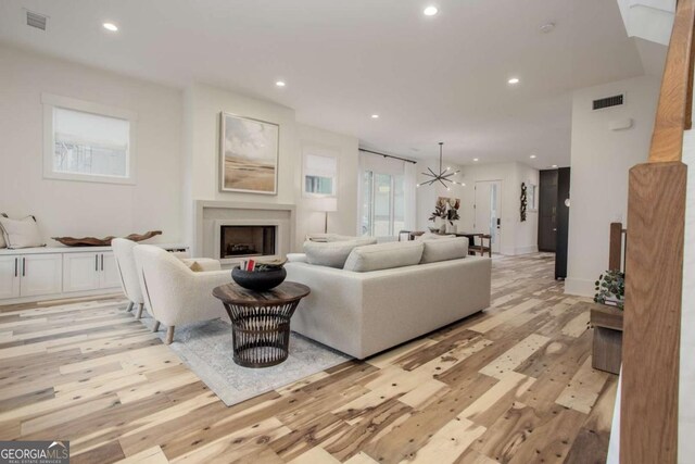 1168 Mado Loop, Chattahoochee Hills, GA 30268 - living room with recessed lighting, light wood-type flooring, and a fireplace