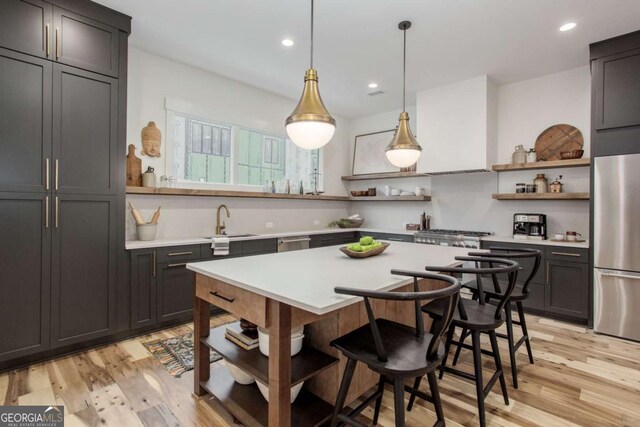 1168 Mado Loop, Chattahoochee Hills, GA 30268 - kitchen with open shelves, appliances with stainless steel finishes, light countertops, a sink, and recessed lighting