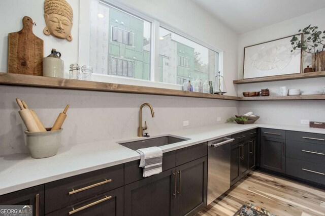 1168 Mado Loop, Chattahoochee Hills, GA 30268 - kitchen featuring open shelves, stainless steel dishwasher, light wood-type flooring, a sink, and light countertops