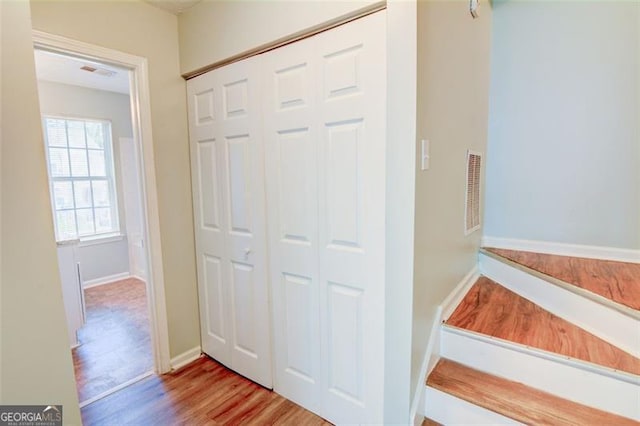 5920 Hampton Ct, College Park, GA 30349 - stairs featuring wood finished floors and baseboards