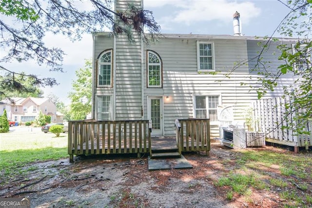 5920 Hampton Ct, College Park, GA 30349 - rear view of house featuring a wooden deck and a chimney
