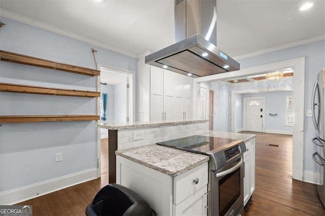 1686 Alvarado Ter SW, Atlanta, GA 30310 - kitchen featuring island range hood, electric range, crown molding, white cabinetry, and a center island