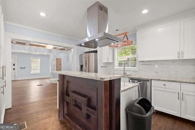 1686 Alvarado Ter SW, Atlanta, GA 30310 - kitchen with island range hood, appliances with stainless steel finishes, a kitchen island, crown molding, and dark wood-style floors