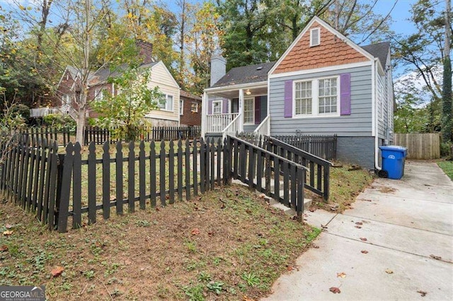 1686 Alvarado Ter SW, Atlanta, GA 30310 - view of front of house with a porch, a fenced front yard, stairway, and crawl space