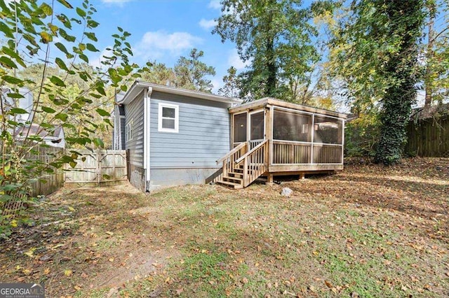 1686 Alvarado Ter SW, Atlanta, GA 30310 - back of house with a sunroom and a fenced backyard