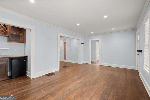 1686 Alvarado Ter SW, Atlanta, GA 30310 - unfurnished living room with crown molding, wood finished floors, and recessed lighting
