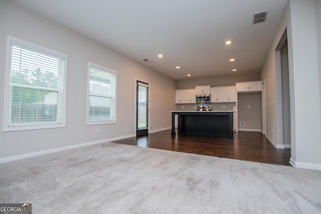 309 Dean Ct, Temple, GA 30179 - living room featuring dark colored carpet, baseboards, recessed lighting, and dark wood-style floors