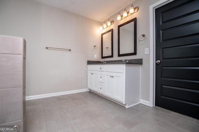 309 Dean Ct, Temple, GA 30179 - bathroom featuring double vanity and baseboards