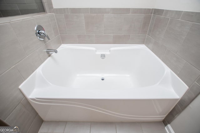 309 Dean Ct, Temple, GA 30179 - bathroom with a bath and tile patterned flooring