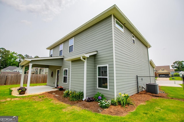 309 Dean Ct, Temple, GA 30179 - back of house featuring a patio area and cooling unit