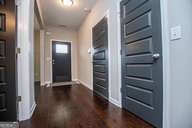 309 Dean Ct, Temple, GA 30179 - foyer entrance featuring dark wood-style floors and baseboards