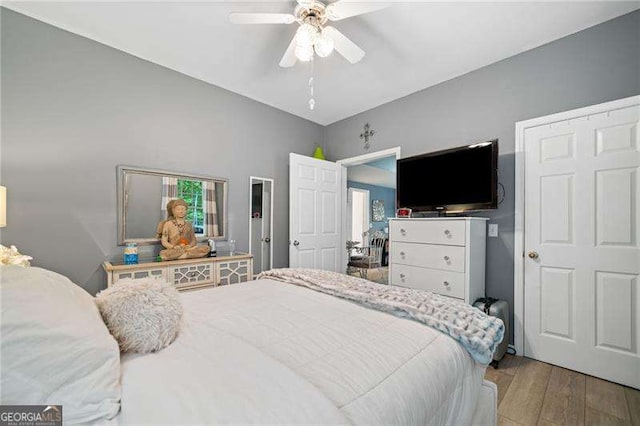 1039 Avery Creek Dr, Woodstock, GA 30188 - bedroom with wood finished floors and a ceiling fan