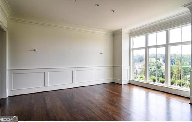 3084 Watsons Bnd, Milton, GA 30004 - spare room featuring ornamental molding, wood finished floors, a decorative wall, and wainscoting