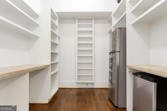 3084 Watsons Bnd, Milton, GA 30004 - walk in closet featuring dark wood-type flooring