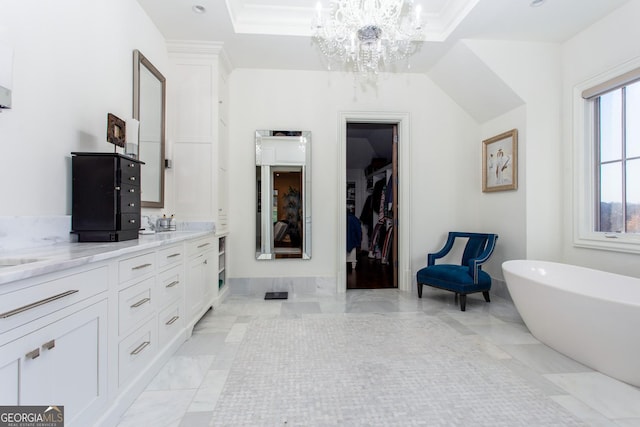 3084 Watsons Bnd, Milton, GA 30004 - full bathroom with a chandelier, double vanity, a freestanding tub, marble finish flooring, and a walk in closet