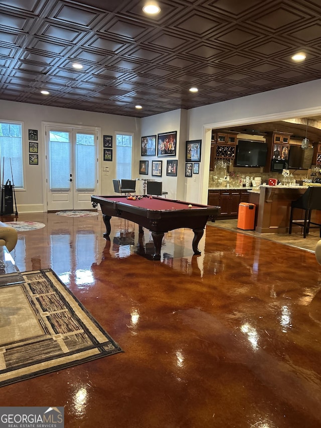 3084 Watsons Bnd, Milton, GA 30004 - rec room with bar with sink, pool table, an ornate ceiling, french doors, and concrete floors