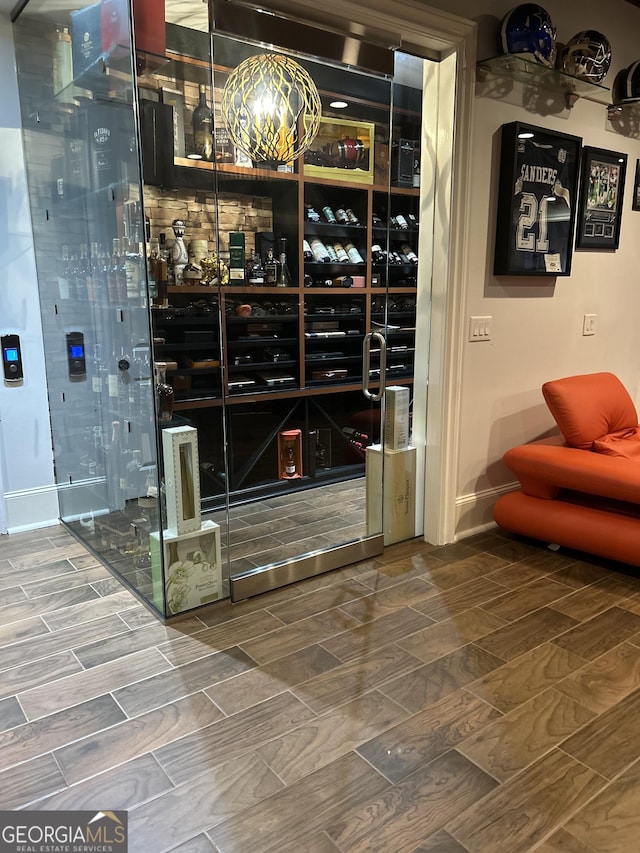 3084 Watsons Bnd, Milton, GA 30004 - wine room with wood finish floors and baseboards