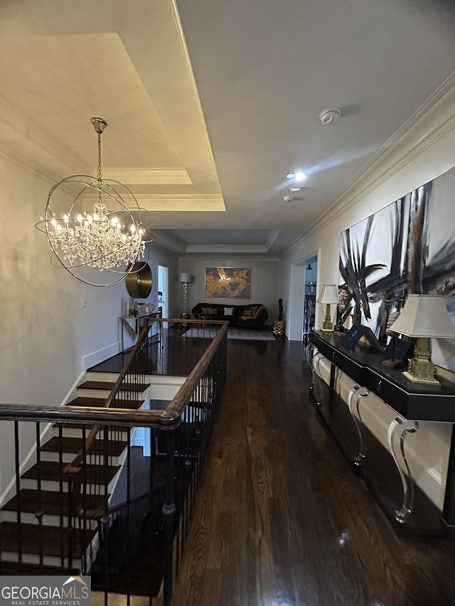 3084 Watsons Bnd, Milton, GA 30004 - dining space featuring wood finished floors, a chandelier, a raised ceiling, ornamental molding, and stairway