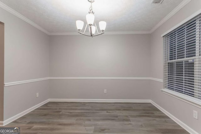 7113 Ambercrest Ct, Austell, GA 30168 - empty room featuring a chandelier, wood finished floors, a textured ceiling, and ornamental molding