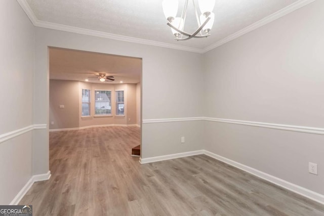 7113 Ambercrest Ct, Austell, GA 30168 - empty room featuring wood finished floors, a chandelier, and crown molding